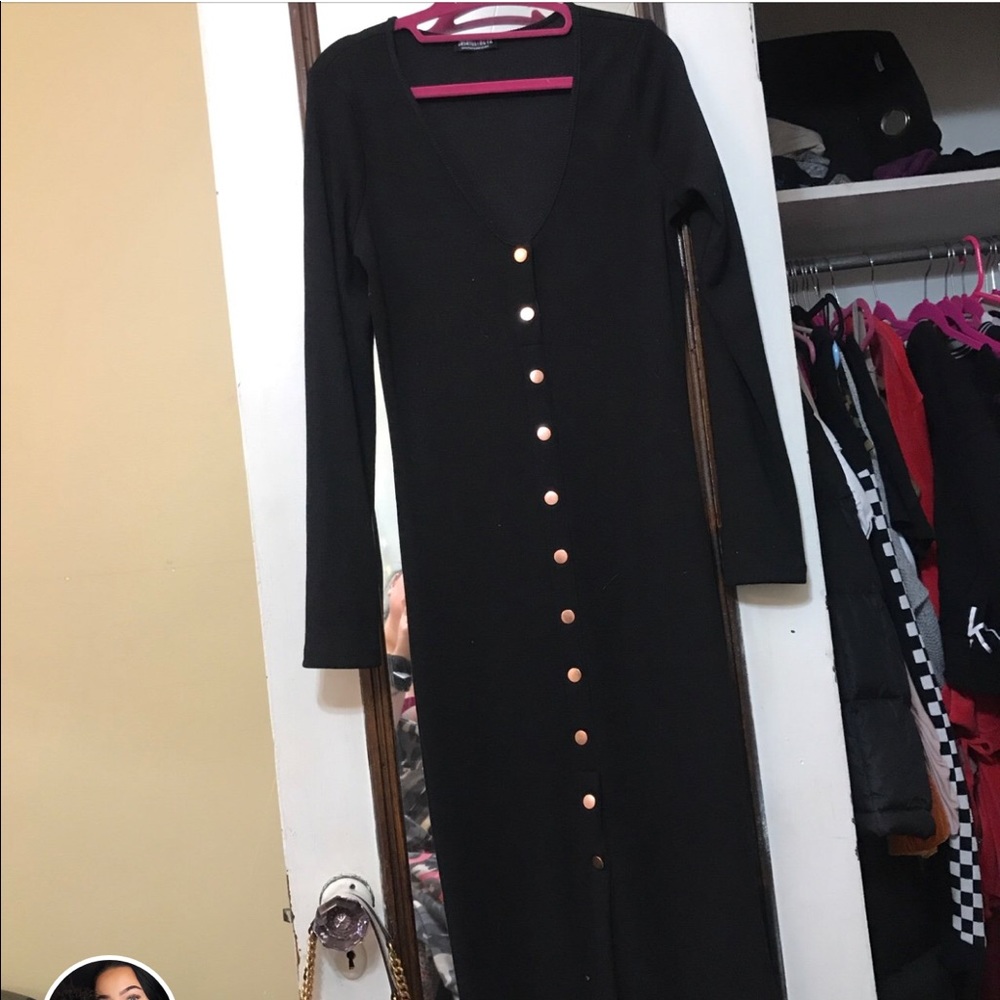Black dress with gold buttons